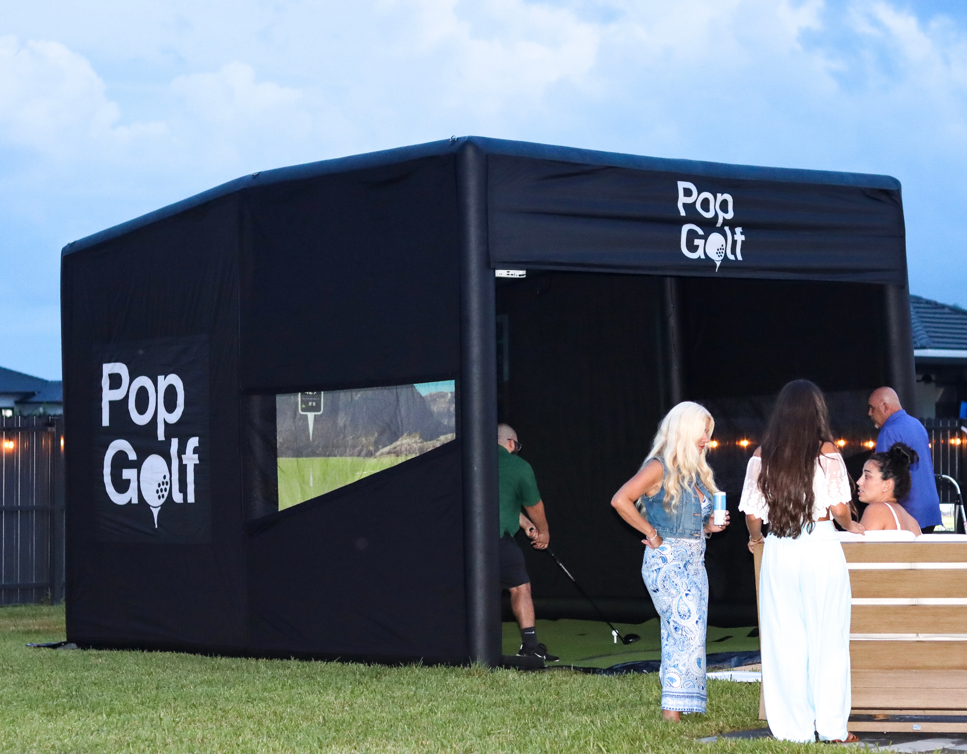 Guests enjoying an outdoor PopGolf setup at a private event
