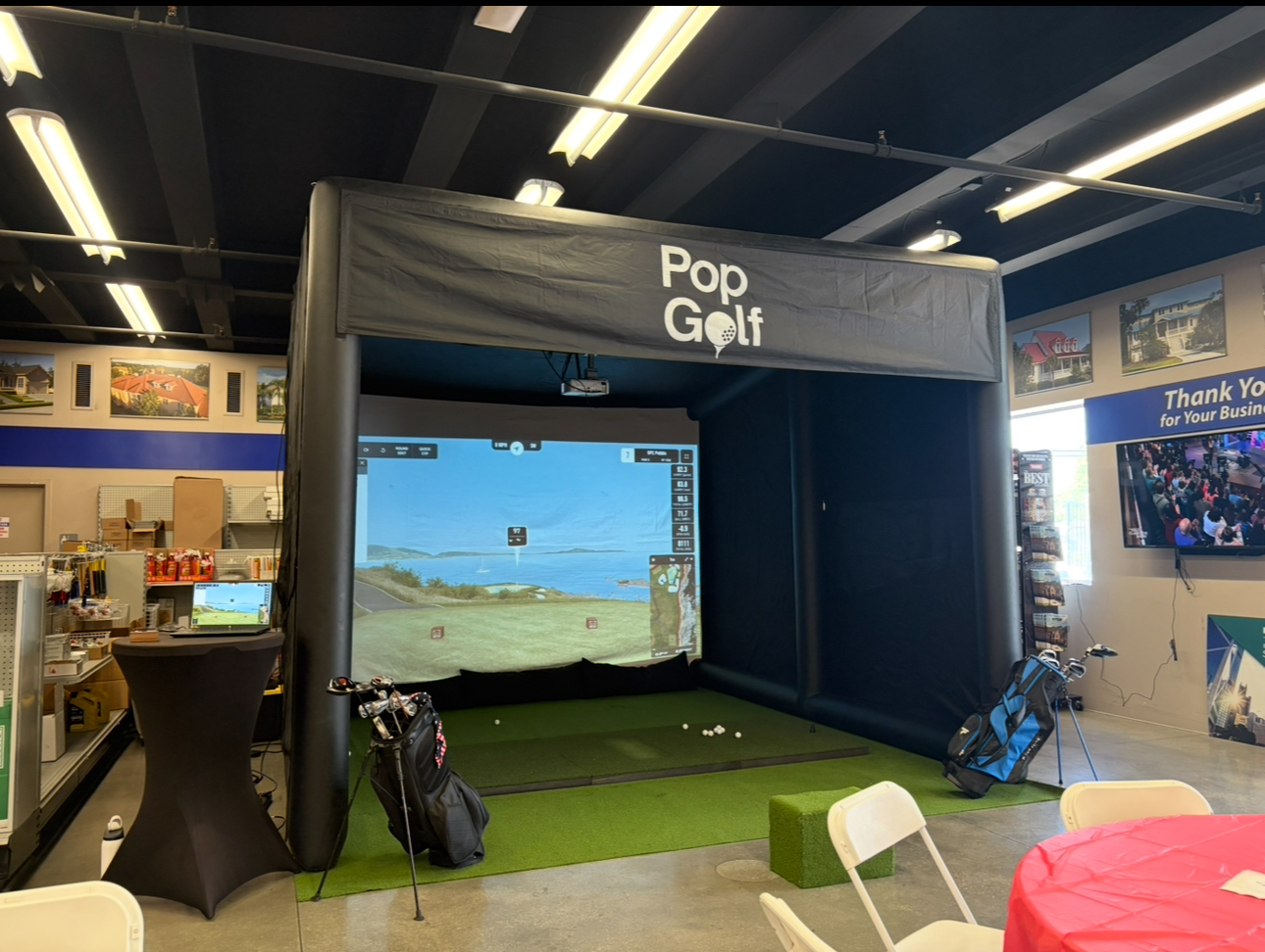 PopGolf simulator activation inside a corporate showroom for a client appreciation event